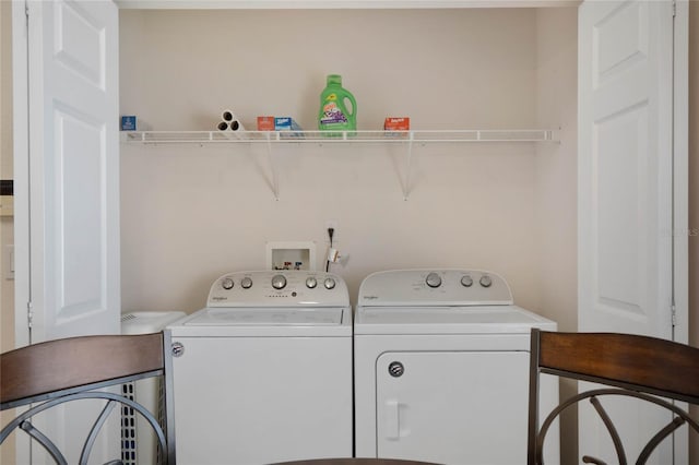 clothes washing area featuring washing machine and clothes dryer