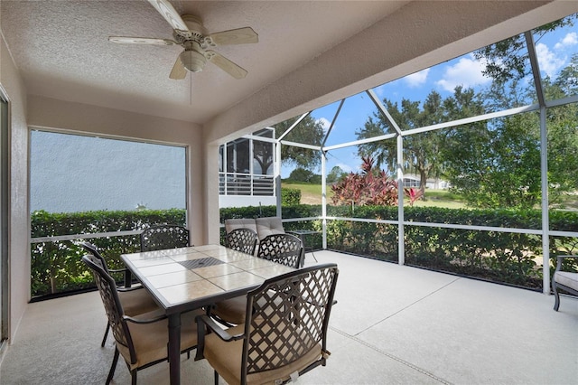 sunroom / solarium with ceiling fan