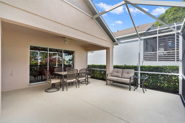 sunroom / solarium with ceiling fan