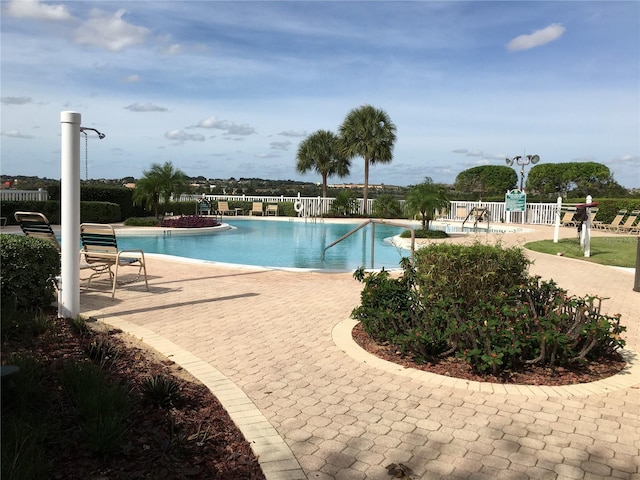 view of swimming pool featuring a patio