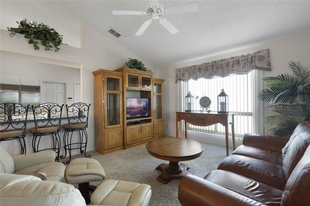 living room with carpet flooring, ceiling fan, high vaulted ceiling, and a textured ceiling