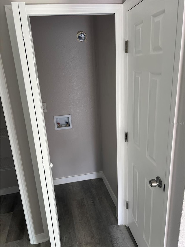 washroom with dark wood-type flooring and washer hookup