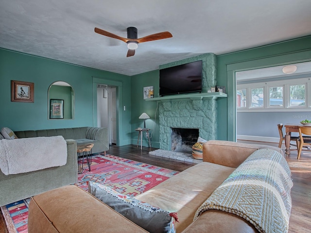 351 W 10th Ave, Mount Dora, FL 32757 - living area with a fireplace, wood finished floors, ceiling fan, and baseboards