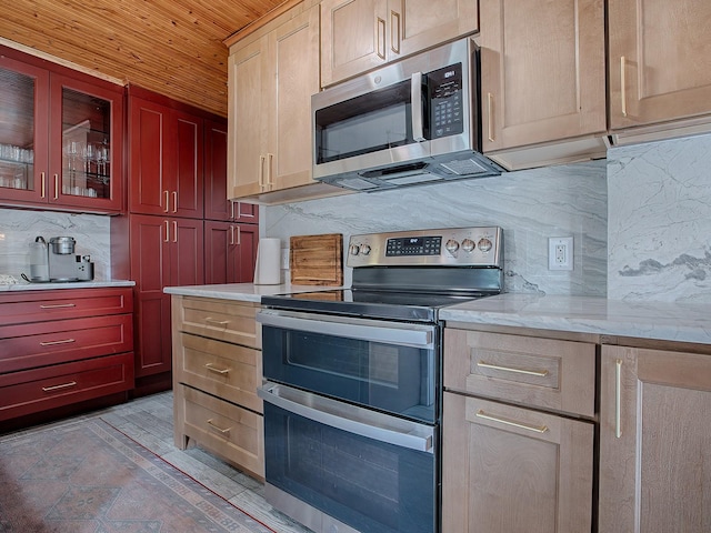 kitchen with appliances with stainless steel finishes, wood ceiling, light stone counters, and backsplash