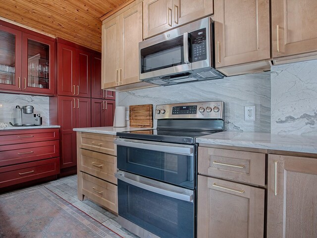 351 W 10th Ave, Mount Dora, FL 32757 - kitchen with appliances with stainless steel finishes, decorative backsplash, wooden ceiling, glass insert cabinets, and light stone countertops