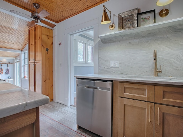 kitchen featuring stainless steel dishwasher, wooden ceiling, a healthy amount of sunlight, and light hardwood / wood-style flooring