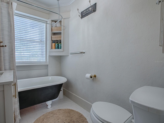 bathroom featuring toilet, tile patterned flooring, a bathtub, and crown molding