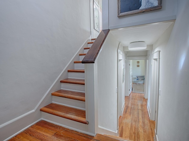 stairway featuring hardwood / wood-style floors