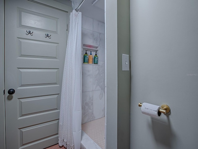 bathroom featuring curtained shower