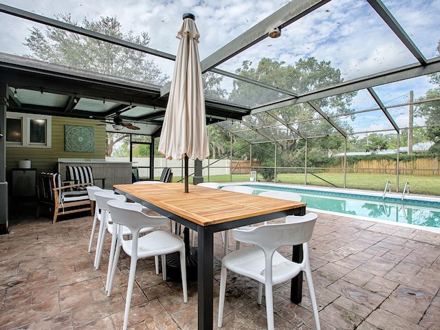 view of patio featuring a fenced in pool, a lanai, and ceiling fan