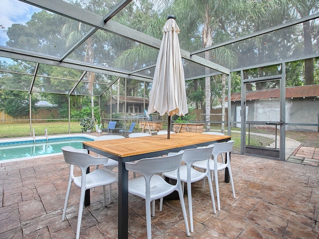 sunroom featuring a swimming pool