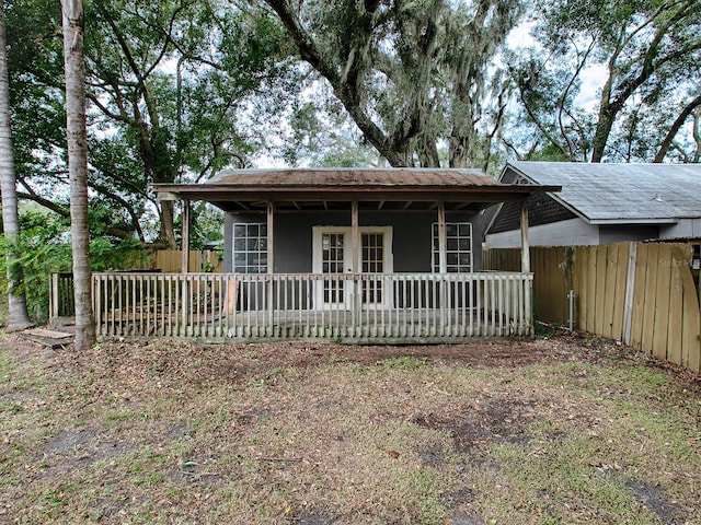 351 W 10th Ave, Mount Dora, FL 32757 - view of front facade with a fenced backyard and french doors