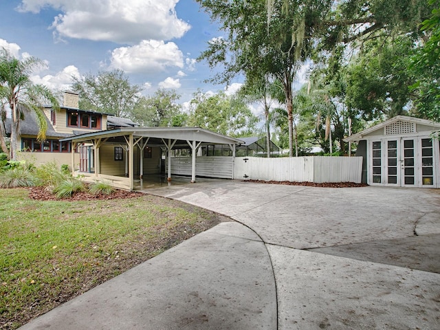 351 W 10th Ave, Mount Dora, FL 32757 - view of yard featuring driveway, fence, and a carport