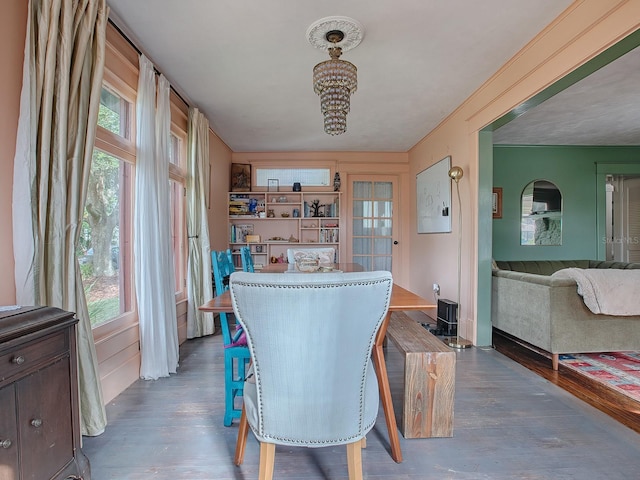 351 W 10th Ave, Mount Dora, FL 32757 - dining space featuring a chandelier and wood finished floors