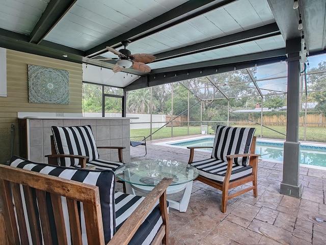 view of patio / terrace featuring ceiling fan, a lanai, and a fenced in pool