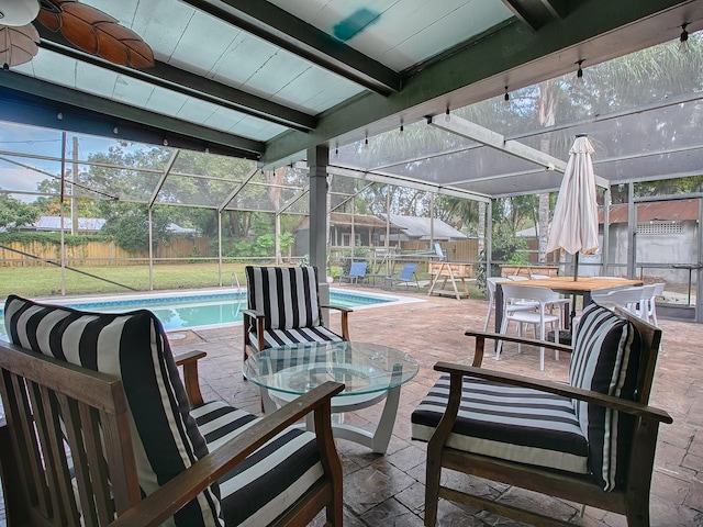 view of patio featuring glass enclosure