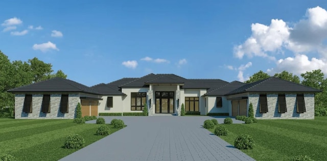 16985 Lucca Ln, Bella Collina, FL 34756 - view of front of home with driveway, stone siding, a front lawn, and an attached garage