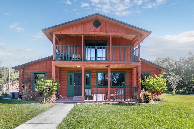 view of front of house with central AC unit, a porch, a front lawn, and a balcony