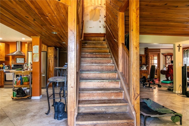 stairs with wood ceiling