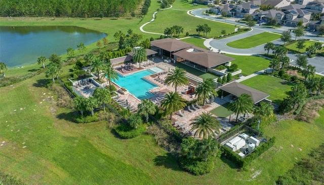 birds eye view of property with a water view