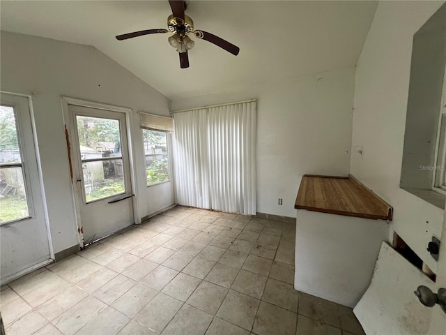 interior space with ceiling fan and lofted ceiling