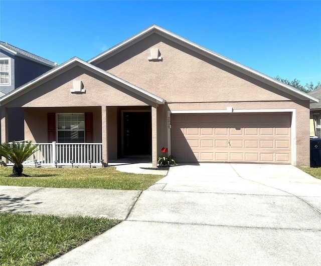 view of front of home featuring a porch and a garage