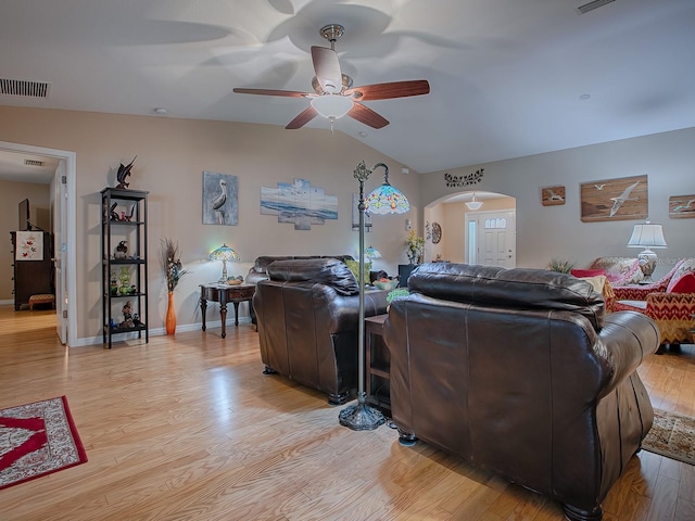 living room with lofted ceiling, ceiling fan, and light hardwood / wood-style flooring