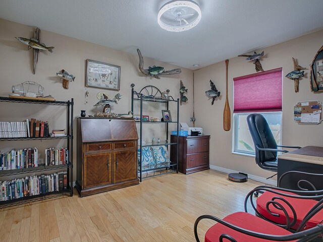 office featuring wood finished floors and baseboards