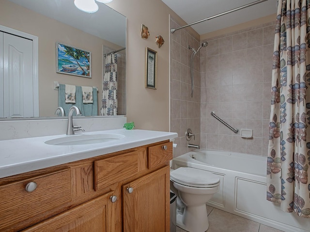 full bathroom with vanity, tile patterned floors, toilet, and shower / tub combo