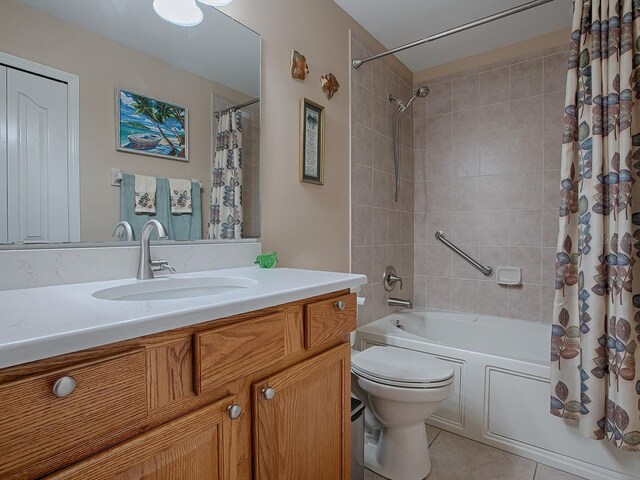 full bath with shower / tub combo with curtain, toilet, tile patterned floors, and vanity