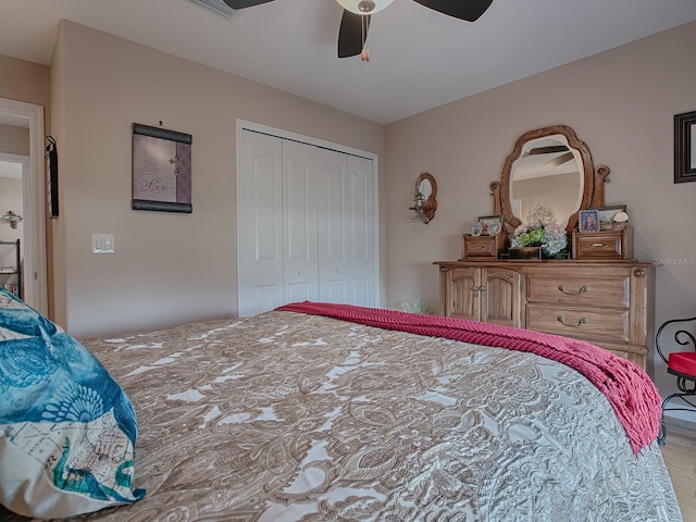 bedroom featuring ceiling fan and a closet