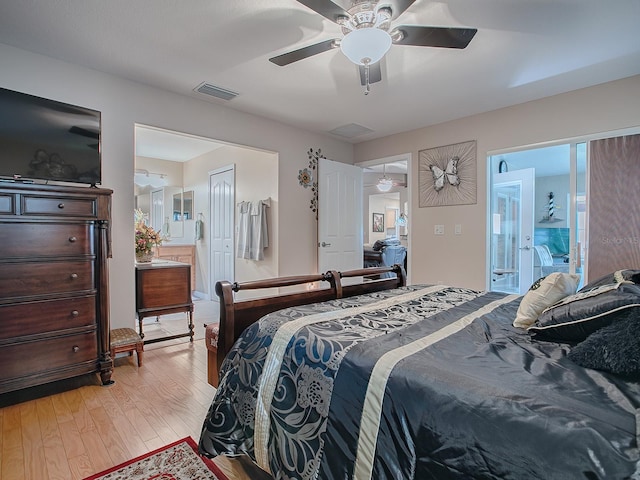 bedroom with ceiling fan, ensuite bath, and light hardwood / wood-style flooring