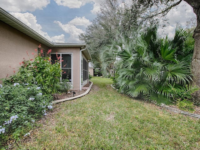 view of yard featuring a sunroom