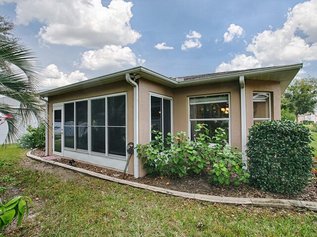 view of property exterior with stucco siding