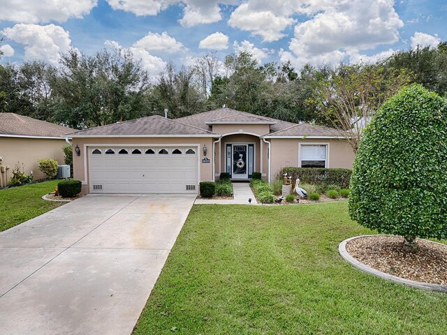 single story home with stucco siding, driveway, central AC unit, an attached garage, and a front lawn