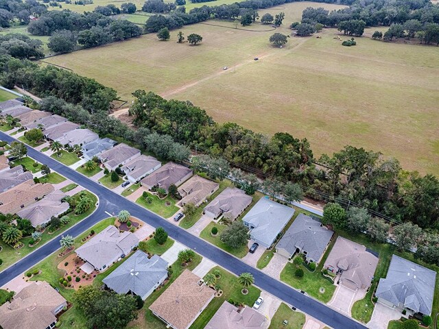 aerial overview of property's location featuring nearby suburban area and rural landscape