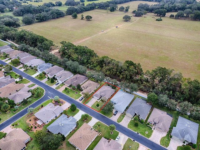 view of property location featuring property parcel outlined, nearby suburban area, and rural landscape