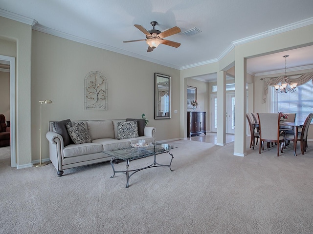 carpeted living room with ceiling fan with notable chandelier and ornamental molding