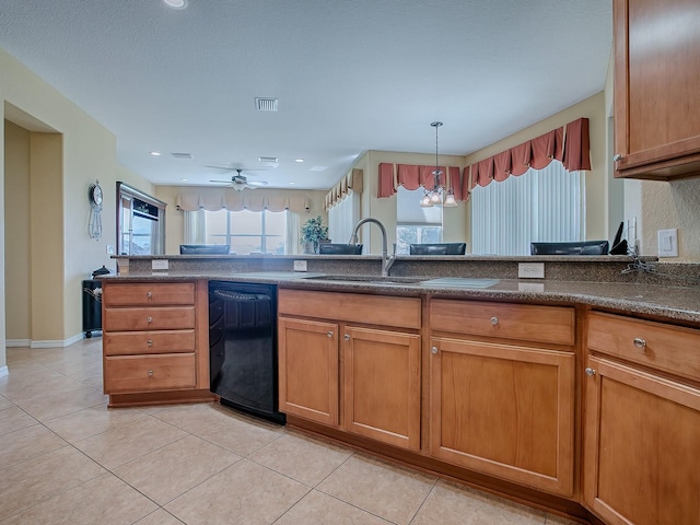 kitchen featuring light tile patterned flooring, sink, kitchen peninsula, hanging light fixtures, and dishwasher