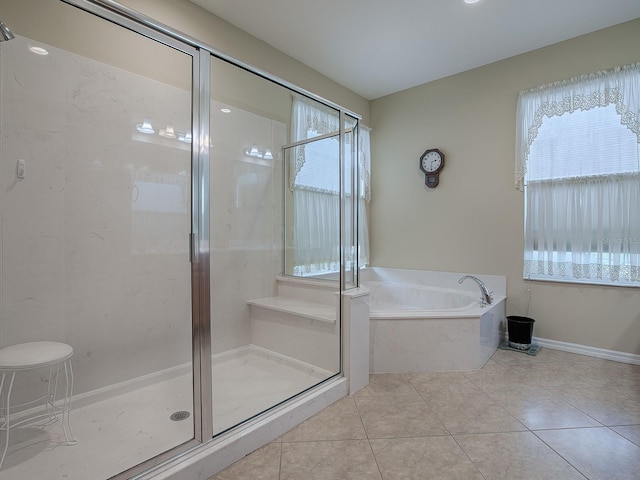 bathroom featuring tile patterned flooring and plus walk in shower