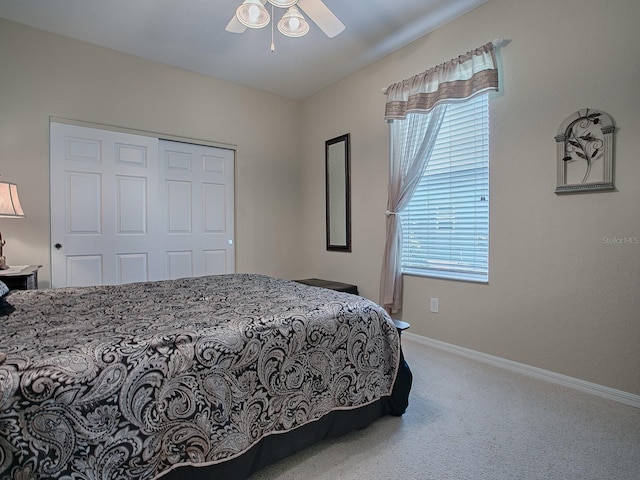 bedroom with a closet, carpet flooring, and ceiling fan