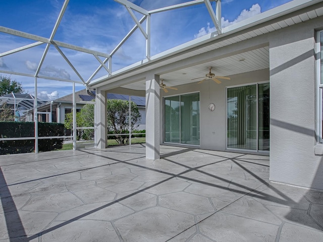 unfurnished sunroom featuring beamed ceiling