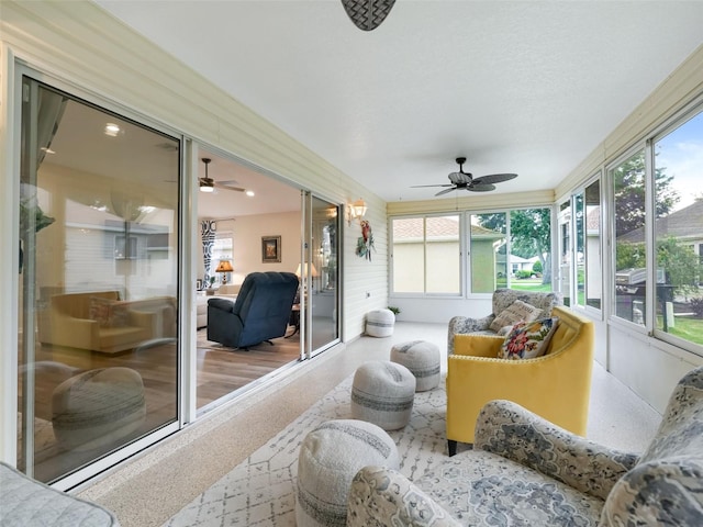 sunroom with ceiling fan and plenty of natural light