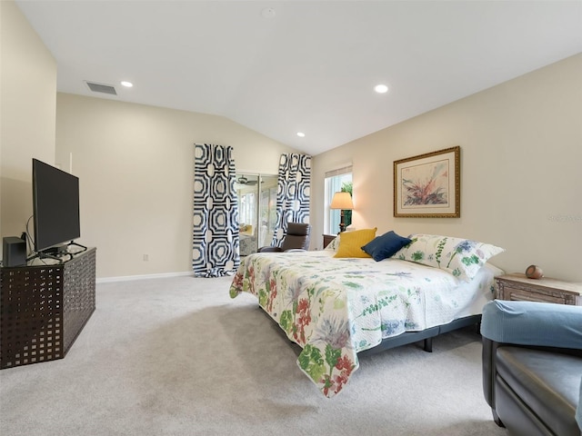 carpeted bedroom with vaulted ceiling