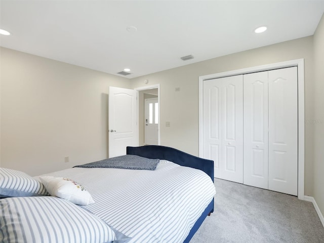 carpeted bedroom with a closet