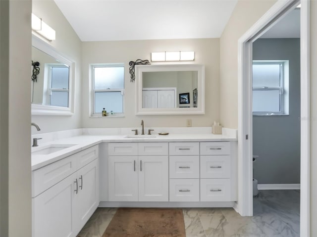 bathroom with a wealth of natural light and vanity