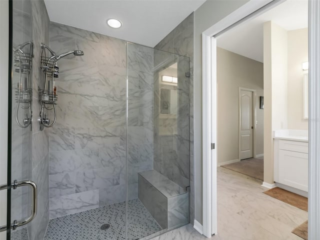 bathroom with vanity and a shower with shower door