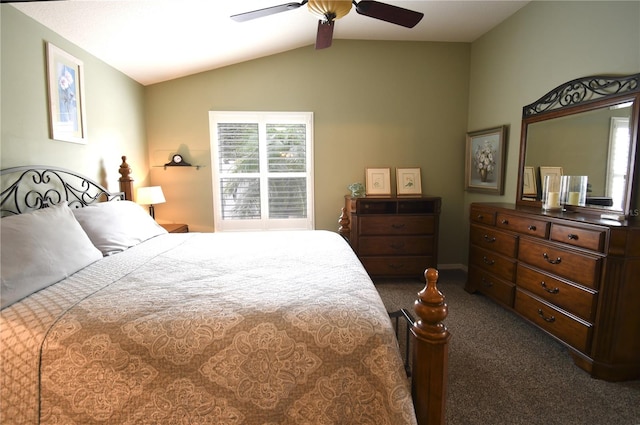 bedroom featuring ceiling fan, vaulted ceiling, and dark colored carpet