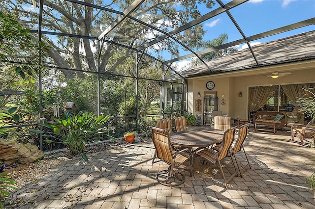 view of patio / terrace with glass enclosure and ceiling fan