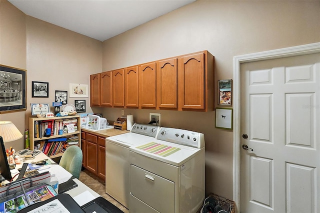 washroom featuring washing machine and dryer and cabinets